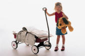 Girl pulling wagon with newspapers